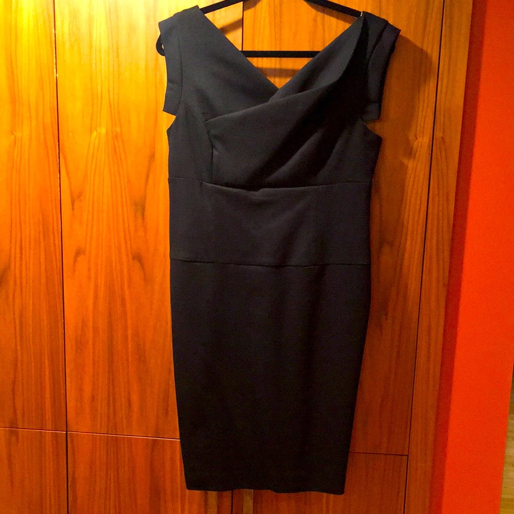 Black BeBe practically new sexy little dress in large. Soft, leopard lining